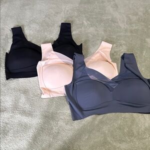 Source Unknown Black, Cream, and Gray Bras